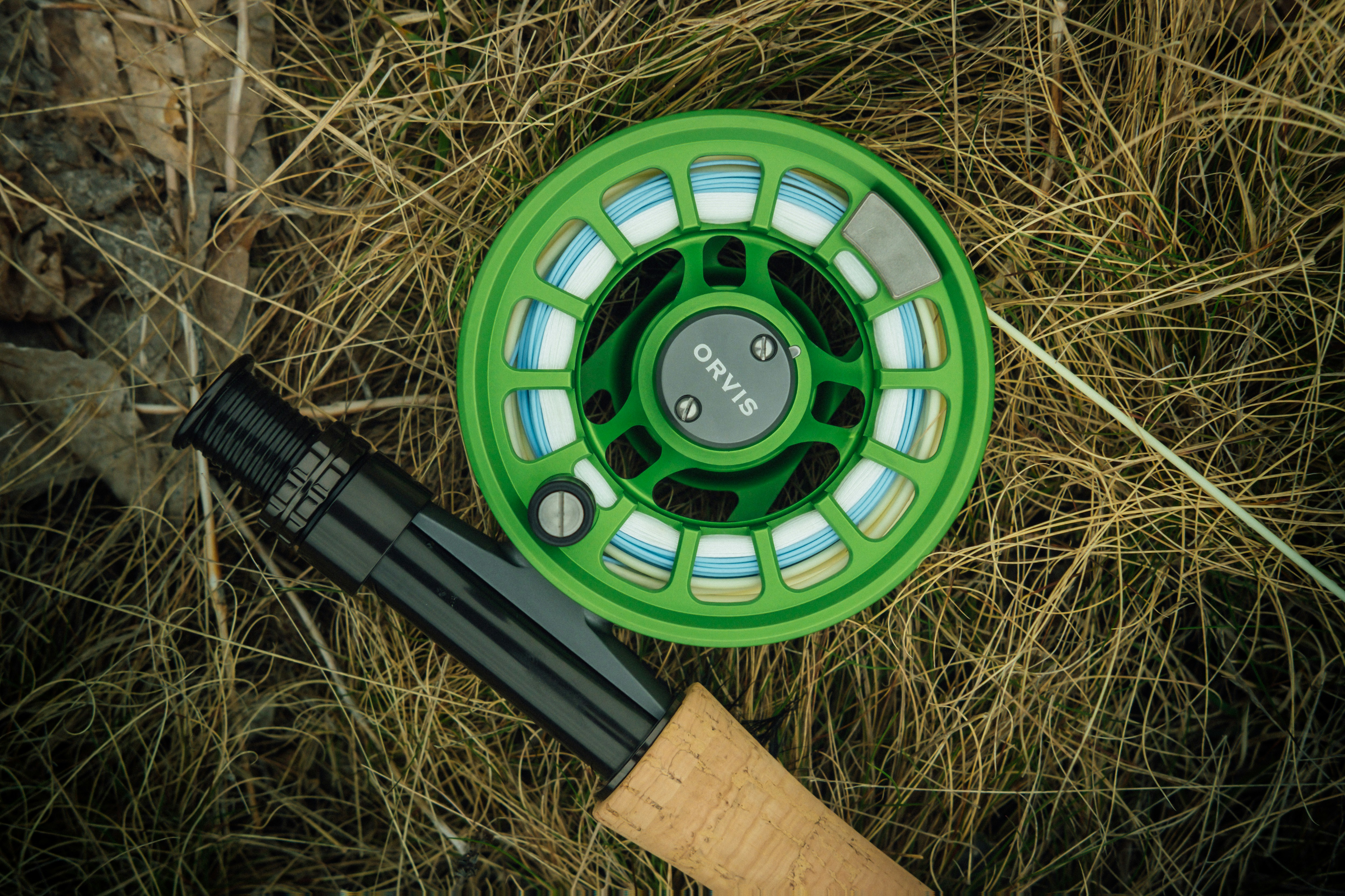 Fly fishing rod and reel setup for bass fishing beside water
